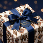 Southwestern cactus wrapping paper with a navy blue satin bow by Wrapped Studios.