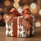 Southwest cactus wrapping paper with a rust ribbon and Welcome Home tag for housewarming by Wrapped Studios.