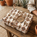 Rustic southwestern cactus wrapping paper on a boho gift box by Wrapped Studios.