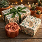 Cactus wrapping paper by Wrapped Studios on rustic gift boxes with a green velvet bow.
