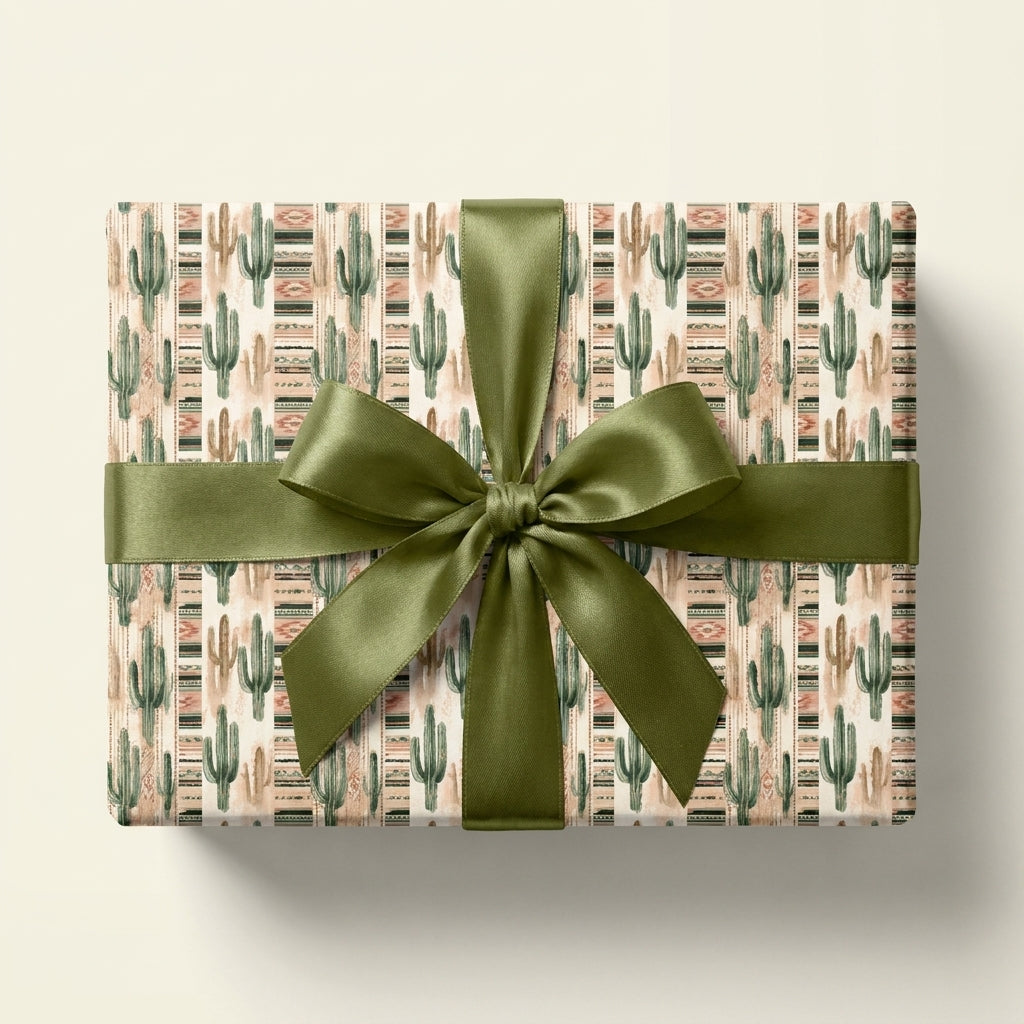 Southwestern cactus wrapping paper on a gift box with olive green satin bow by Wrapped Studios.