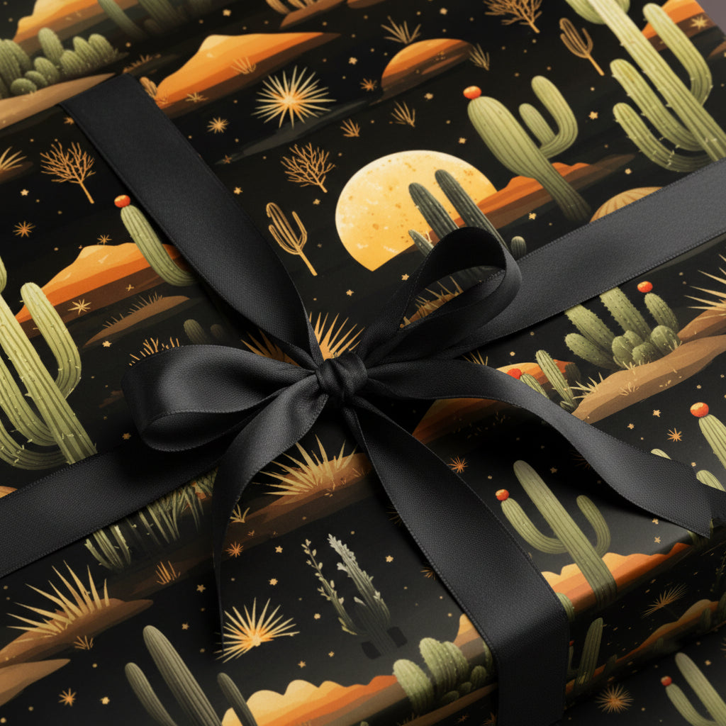 Gift wrapped in black desert cactus pattern wrapping paper with a black satin ribbon.