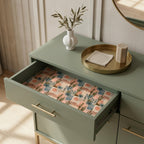 Boho cactus wrapping paper used as a drawer liner in a sage green dresser by Wrapped Studios.