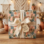 Boho desert wrapping paper with cacti by Wrapped Studios, styled with a cream ribbon for a housewarming gift.