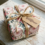 Boho dreamcatcher floral wrapping paper with rustic twine on a gift box by Wrapped Studios.