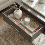 Southwestern wrapping paper with red and teal Aztec pattern lining a wooden drawer by Wrapped Studios.
