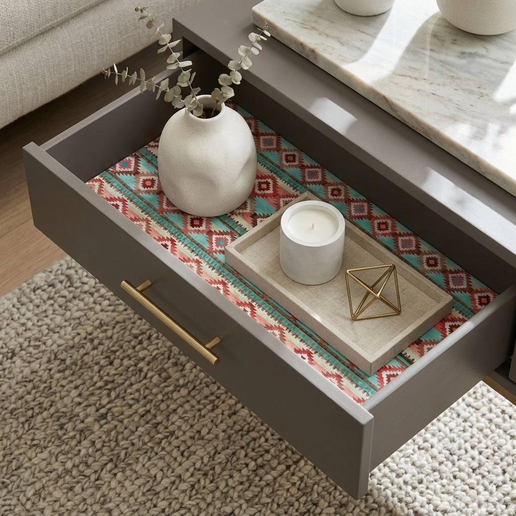 Southwestern wrapping paper with red and teal Aztec pattern lining a wooden drawer by Wrapped Studios.