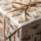 Rustic Native American watercolor wrapping paper with teepees and raffia bow by Wrapped Studios.