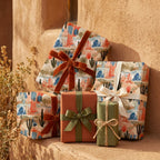Desert cactus wrapping paper on rustic gifts with velvet ribbons by Wrapped Studios.