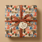 Desert cactus wrapping paper with terracotta raffia ribbon and gift tag by Wrapped Studios.