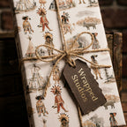 Vintage Western wrapping paper with watercolor Native American illustrations and twine bow, by Wrapped Studios.