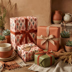 Boho southwestern wrapping paper with cactus print and rust velvet ribbons, by Wrapped Studios.