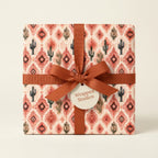 Southwestern cactus gift wrap with a terracotta ribbon and gift tag by Wrapped Studios.