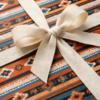 Southwestern wrapping paper with rustic terracotta boho pattern and cream ribbon bow, by Wrapped Studios.