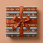 Rustic southwestern wrapping paper featuring a geometric tribal pattern and copper bow by Wrapped Studios.