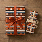 Rustic southwestern wrapping paper in terracotta and blue on gifts with bows by Wrapped Studios.