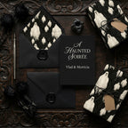 Gothic ghost wrapping paper and elegant black Halloween invitation set by Wrapped Studios.