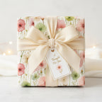 Elegant floral wrapping paper with a cream-colored ribbon, bow, and gift tag saying "A Thought For You."