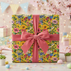 Bright yellow floral wrapping paper with a pink velvet ribbon, perfect for a spring birthday gift.