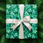 Square gift wrapped in green shamrock St. Patrick's Day wrapping paper with a white ribbon.