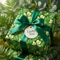 St. Patrick's Day gift wrapped in clover wrapping paper with a green ribbon and a "Lucky You" gift tag.