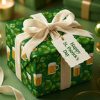 St. Patrick's Day wrapping paper with green shamrocks and beer mugs on a gift with a cream bow, Wrapped Studios.