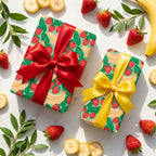 Strawberry banana fruit wrapping paper with red and yellow satin bows by Wrapped Studios.