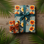 Floral wrapping paper with orange hibiscus flowers, teal ribbon, and velvet bow for birthday or tropical-themed gifts.