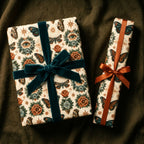 Mystical butterfly wrapping paper with luxury velvet ribbons on gifts by Wrapped Studios.