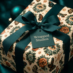 Luxury mystical wrapping paper with butterflies and eyes, tied with a teal ribbon by Wrapped Studios.