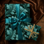 Luxury teal botanical wrapping paper with elegant satin and gold ribbons by Wrapped Studios.