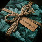 Vintage botanical gift wrap in teal with rustic twine bow and handmade tag from Wrapped Studios.