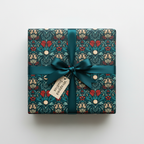 Luxury vintage floral wrapping paper in teal with red berries and a satin green ribbon, perfect for Christmas or elegant gifts.