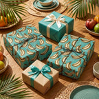 Teal tropical wrapping paper with banana pattern on gift boxes on a wooden table by Wrapped Studios.