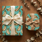 Teal banana wrapping paper with elegant cream and beige bows by Wrapped Studios.