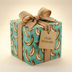 Teal banana wrapping paper by Wrapped Studios on a gift box with a beige ribbon and 'Just because' tag.