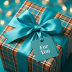 Teal and orange plaid wrapping paper with a satin ribbon and gift tag by Wrapped Studios.