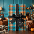 Teal and orange plaid birthday wrapping paper with a black bow for dad, by Wrapped Studios.