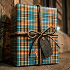 Blue and orange plaid wrapping paper with rustic twine and a 'No Peeking' tag by Wrapped Studios.