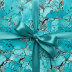 Teal stone-patterned gift box with matching ribbon, perfect luxury gift wrap for any occasion.