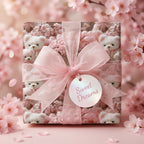 Pink teddy bear and cherry blossom baby shower wrapping paper with a sheer ribbon bow by Wrapped Studios.