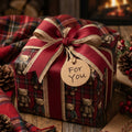 Vintage teddy bear plaid Christmas wrapping paper on a gift box with a rustic bow by Wrapped Studios.
