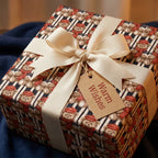 Vintage teddy bear Christmas wrapping paper with a cream bow and Warm Wishes tag by Wrapped Studios.
