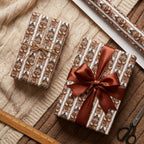 Teddy bear Christmas wrapping paper on holiday gifts with a brown satin bow, by Wrapped Studios.