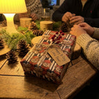 Teddy bear birthday wrapping paper by Wrapped Studios on a rustic gift box with twine and a tag.