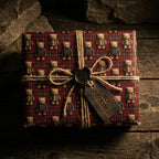 Vintage teddy bear wrapping paper on a rustic Christmas gift box with twine, from Wrapped Studios.