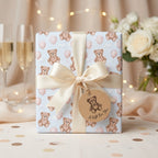 Teddy bear baby shower wrapping paper with a cream satin bow by Wrapped Studios.