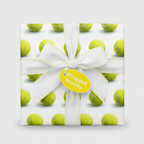 Gift wrapped in tennis ball wrapping paper with white ribbon and Wrapped Studios tag.