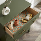 Sage green and terracotta floral wrapping paper used as a drawer liner by Wrapped Studios.