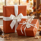 Burnt orange wrapping paper on gifts with white ribbon; Fall harvest gift wrap.
